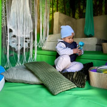 small boy watched calming sensory toy