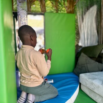 boy watches calming sensory toys